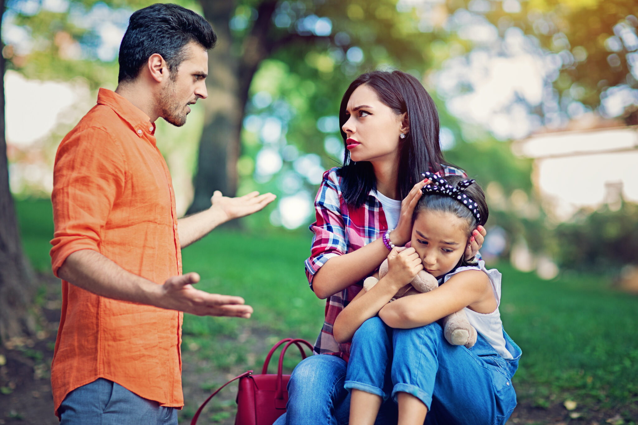 Family arguing in a park