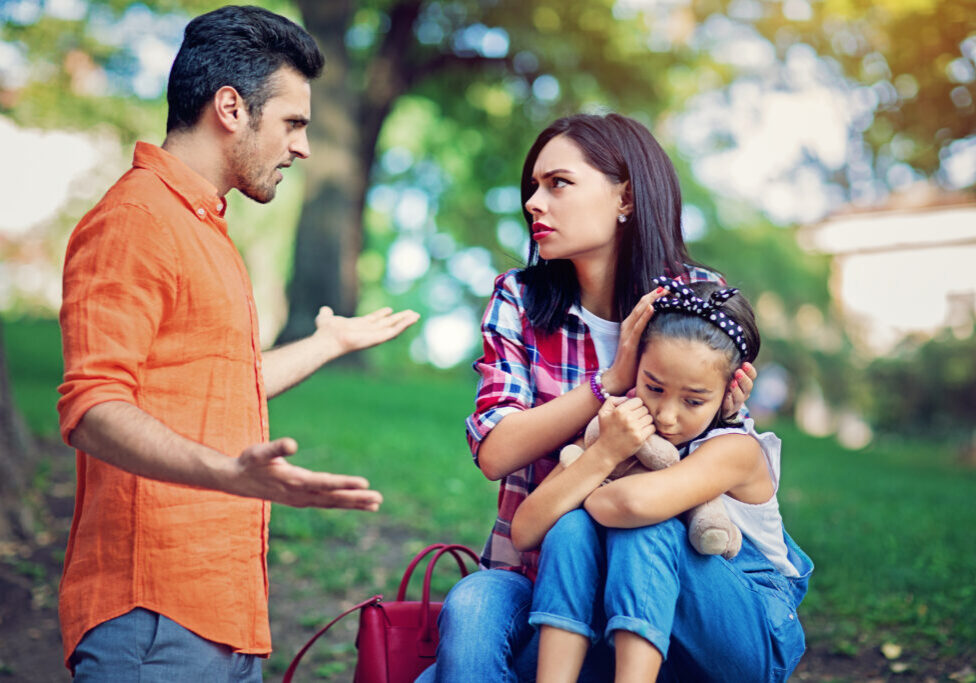 Family arguing in a park